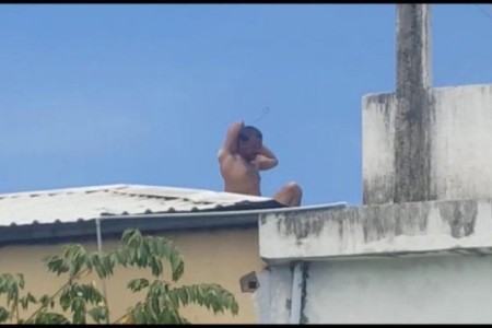 Man Burns House and Sits on Roof (Video Added)