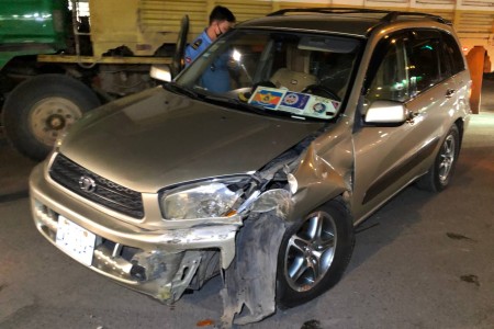 Well Stickered RAV4 Takes On Divider